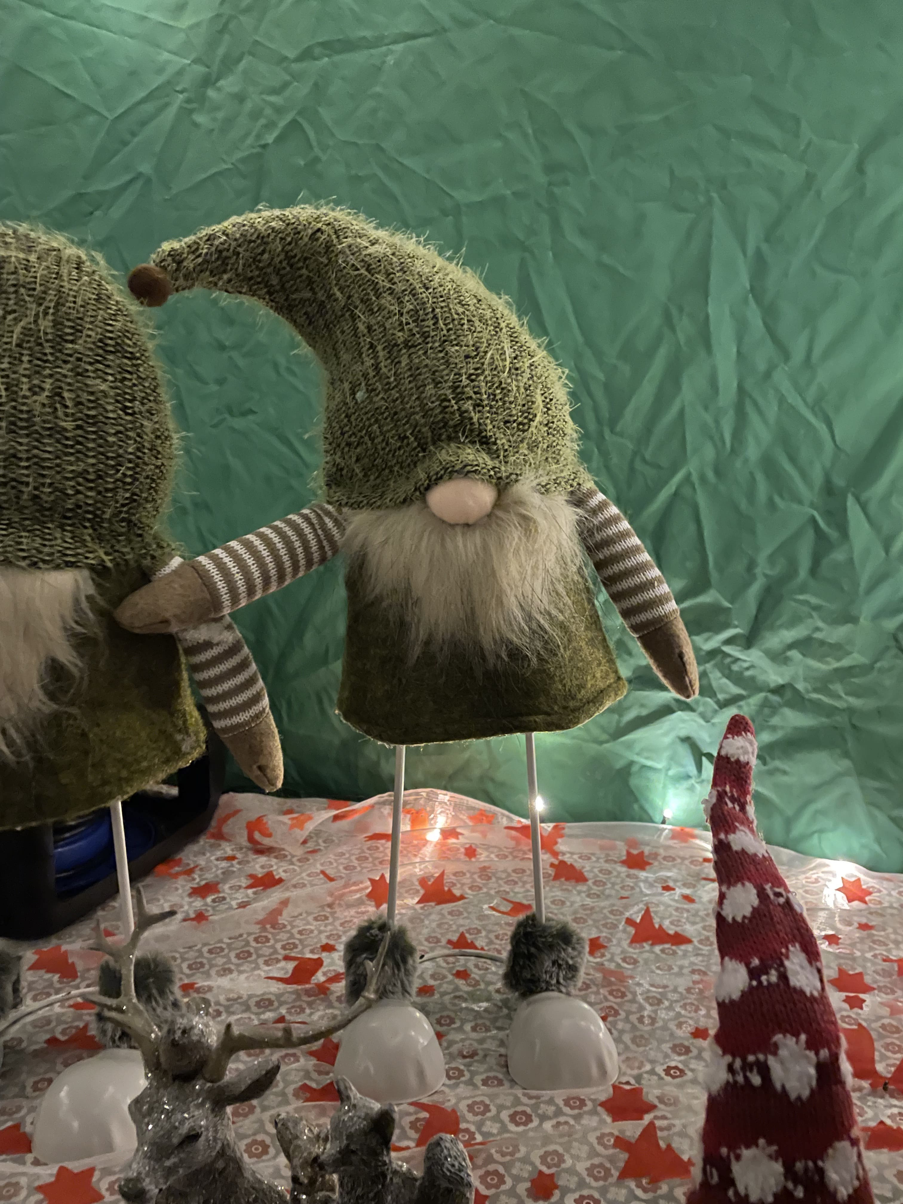 Cosy living room with a decorated Christmas tree glowing at dusk